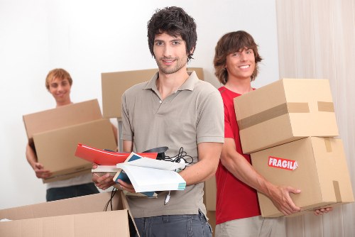 Storage quote paperwork beside packed boxes and moving supplies