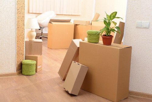 Apartment move with movers carrying furniture in Hithergreen